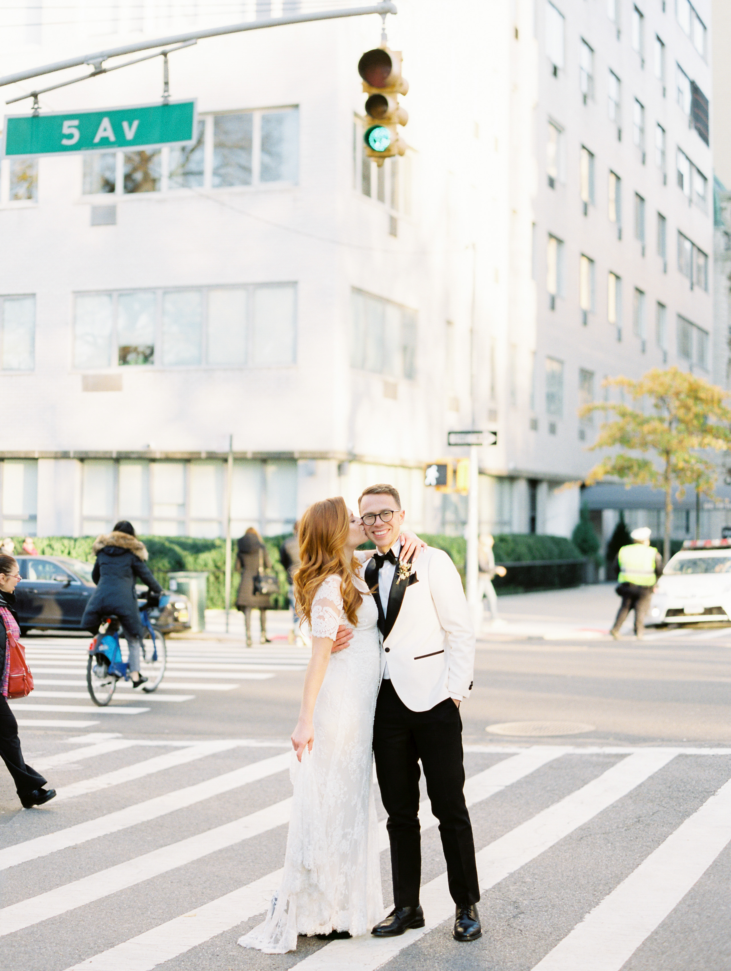 bride kissing groom in NYC