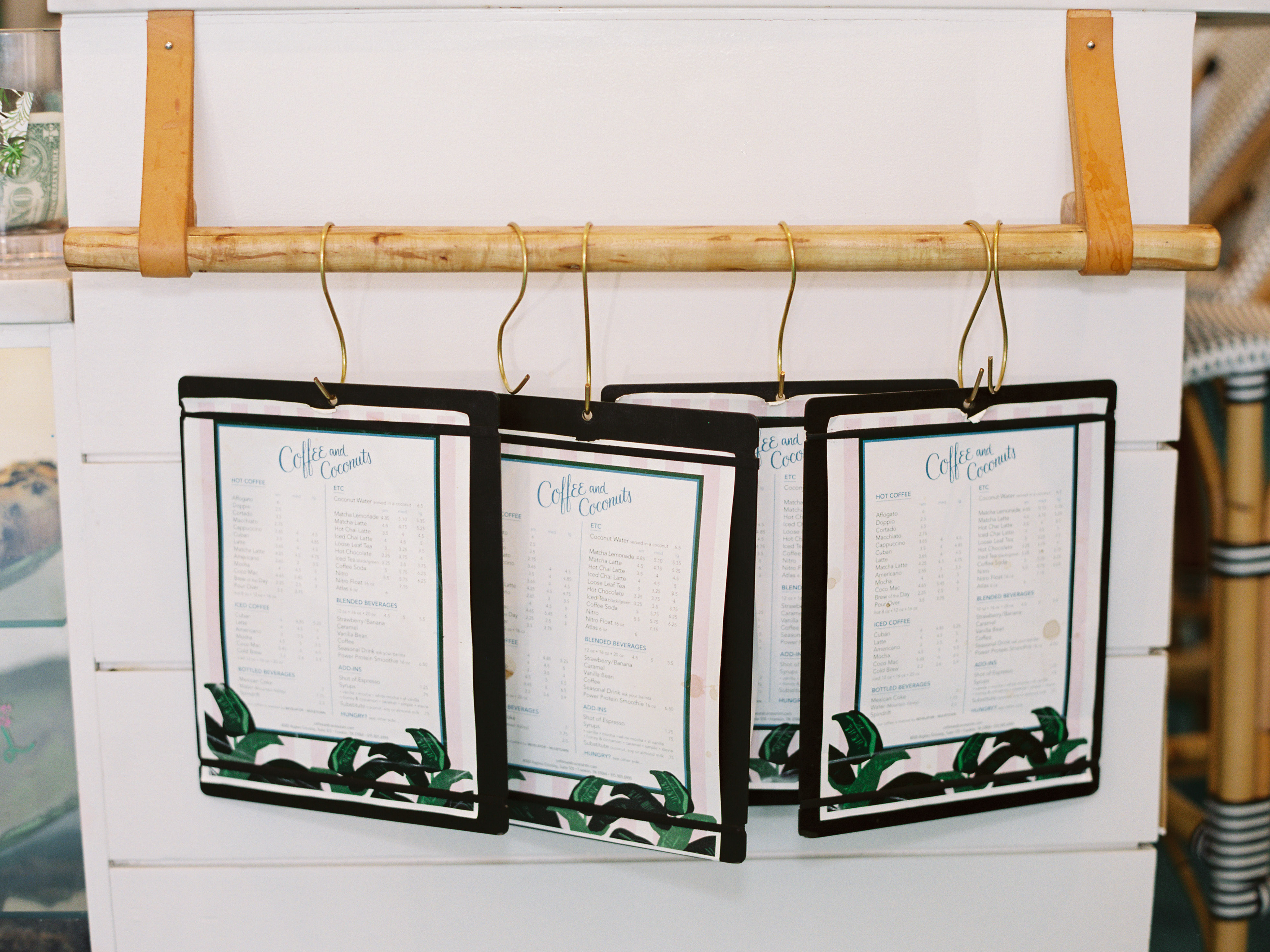 menus hanging in tropical themed coffee shop
